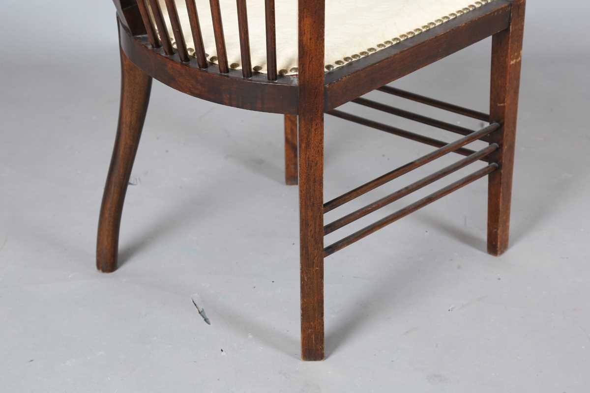 An Edwardian Arts and Crafts style stained walnut showframe armchair, upholstered in cream fabric, - Image 12 of 17