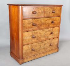 A mid-Victorian walnut chest of drawers with rounded corners and turned handles, height 120cm, width