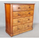 A mid-Victorian walnut chest of drawers with rounded corners and turned handles, height 120cm, width