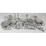 A large collection of mainly 19th century pewter, including three large chargers, various plates,