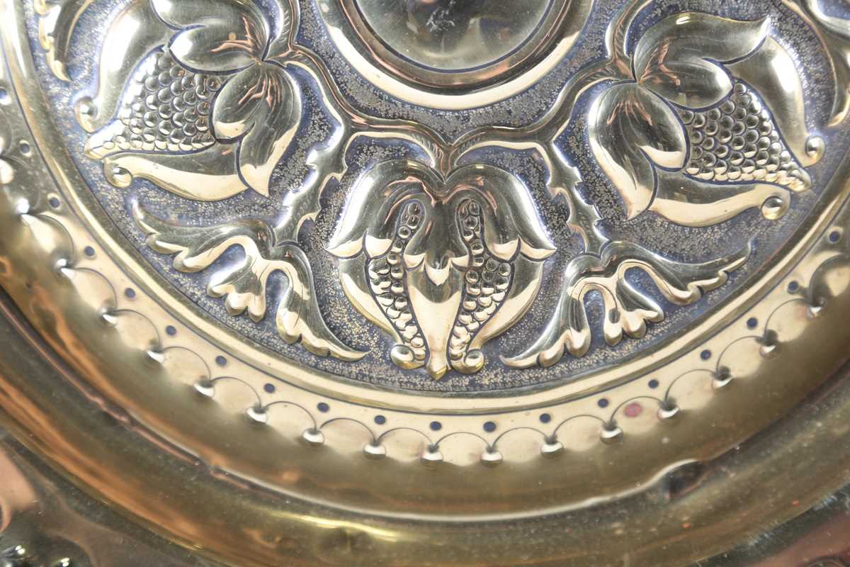 An early 20th century Arts and Crafts brass charger, the centre finely worked with a band of - Image 4 of 17