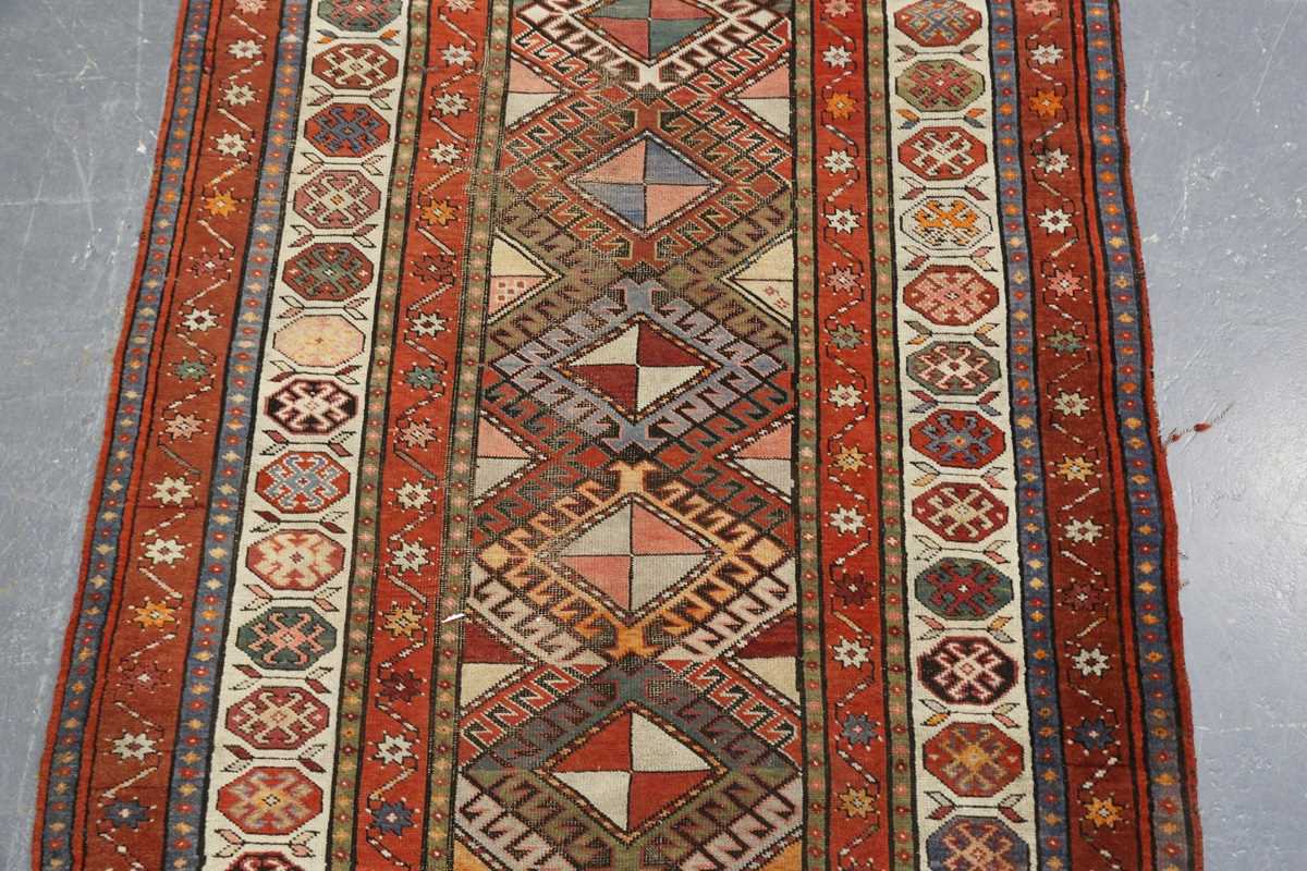 A Kazak runner, Caucasus, early 20th century, the polychrome field with a column of hooked - Image 3 of 6