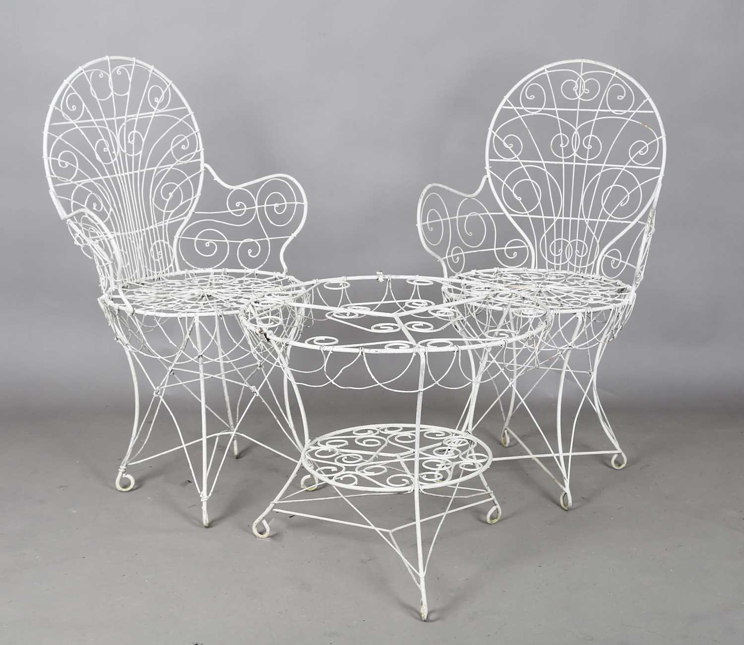 A pair of early 20th century wirework garden chairs, height 97cm, width 54cm, and a matching