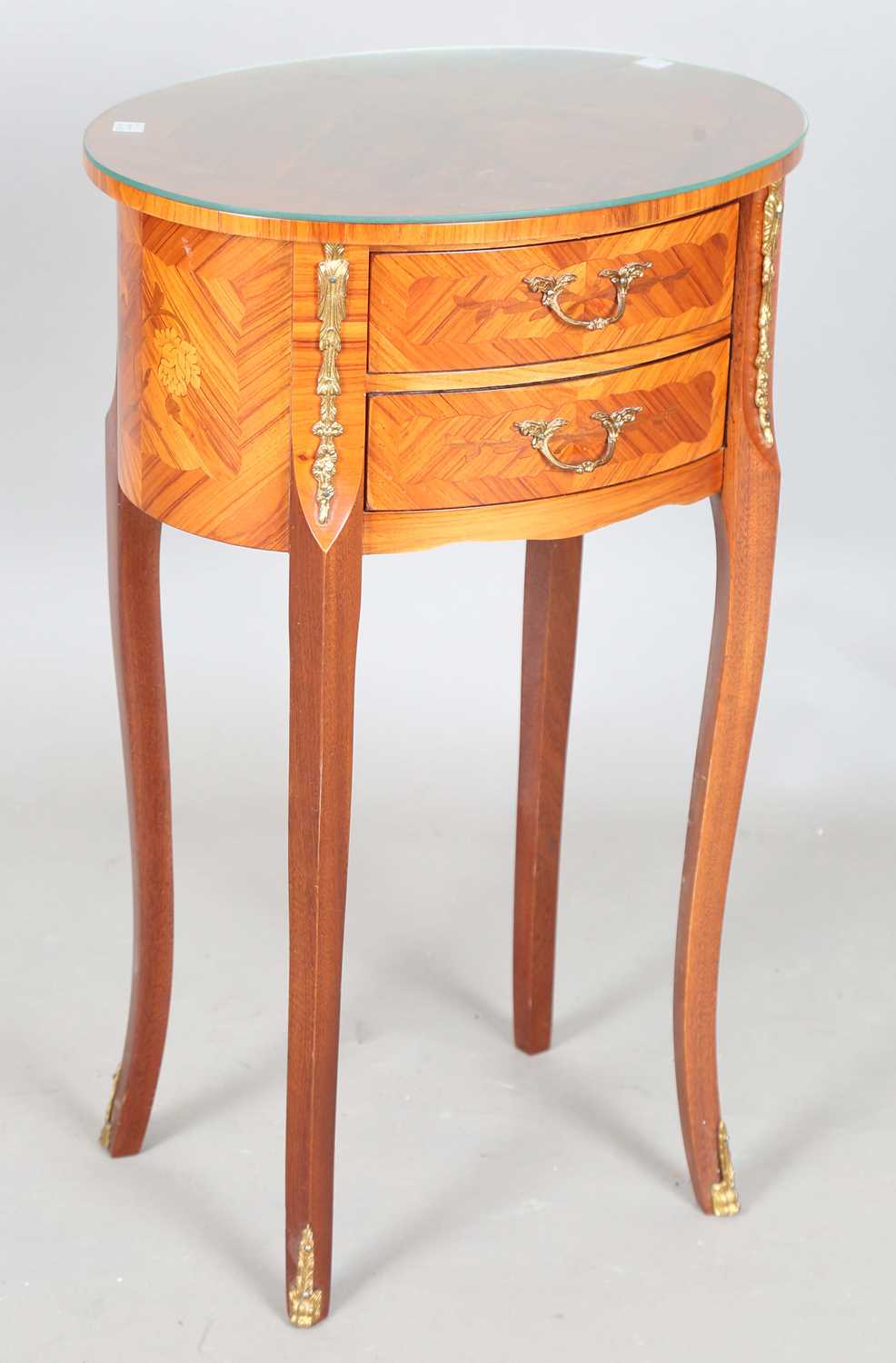 A late 20th century French kingwood and gilt metal mounted oval bedside table, height 65cm, width