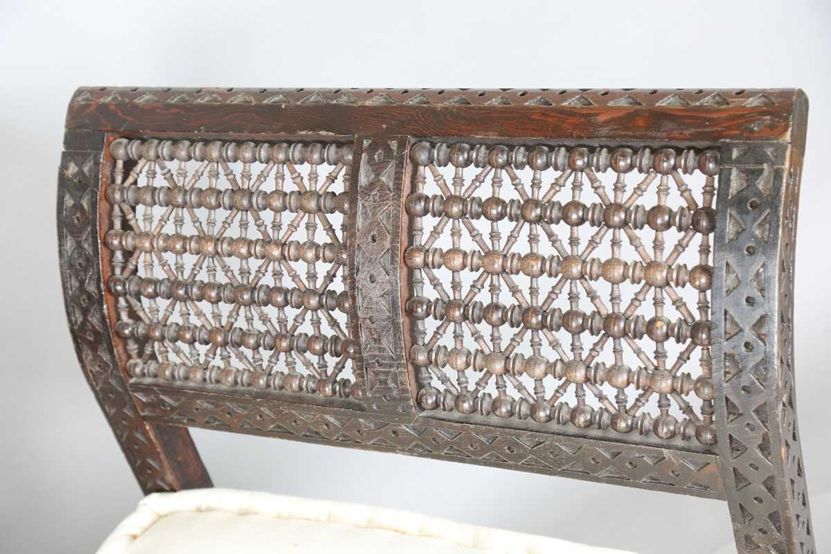 An early 20th century Middle Eastern softwood daybed, similar to those retailed by Liberty & Co, - Image 2 of 15