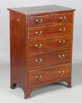 An early 20th century George III style mahogany narrow chest of six drawers with boxwood