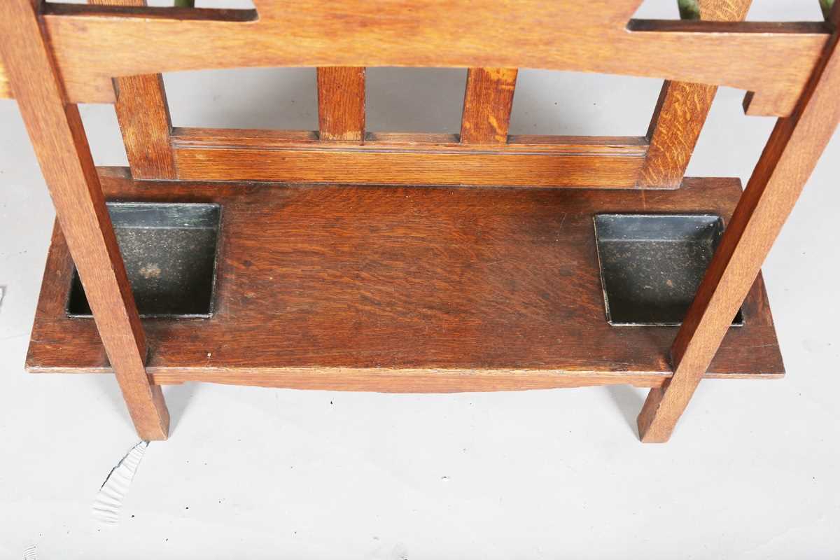 An Edwardian Arts and Crafts Glasgow School oak hallstand, the mirrored back inset with glazed - Image 10 of 13