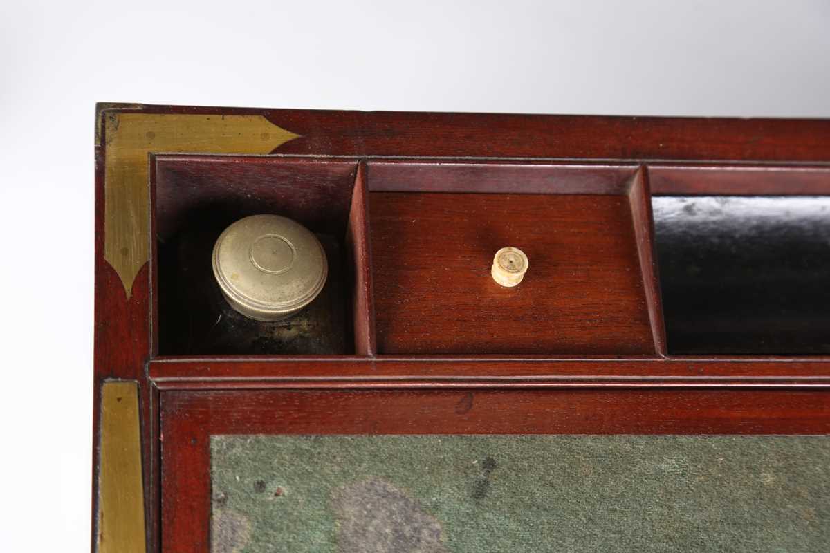 A late George III mahogany and gilt brass bound campaign style writing slope, the sides with brass - Image 3 of 15