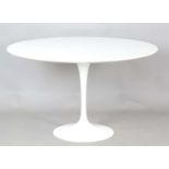 A Knoll Studio white finished 'Tulip' table, originally designed by Aero Saarinen, the circular