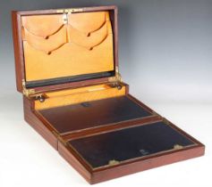 A 19th century mahogany writing box, the lid with engraved brass recessed handle, the hinged writing