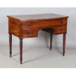 An early Victorian mahogany bowfront kneehole dressing table, fitted with three frieze drawers,