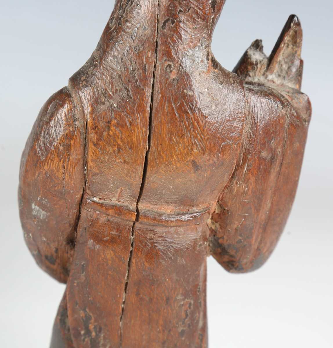 A Continental carved wooden figure of a saint, 16th/17th century, modelled holding a staff, length - Bild 12 aus 15