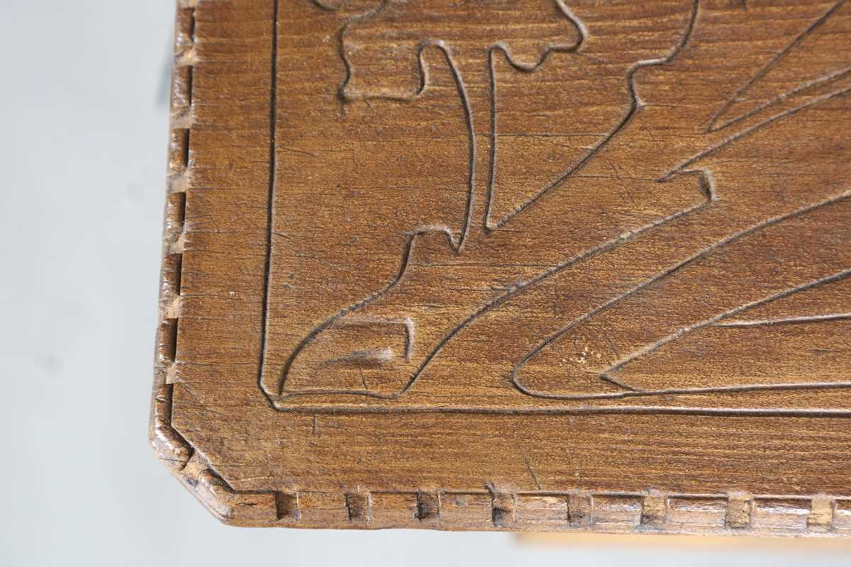 A 20th century Arts and Crafts style carved softwood centre table, the top decorated with wheat - Image 3 of 10