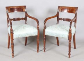 A set of eight Regency mahogany and brass inlaid bar back dining chairs, comprising two carvers,