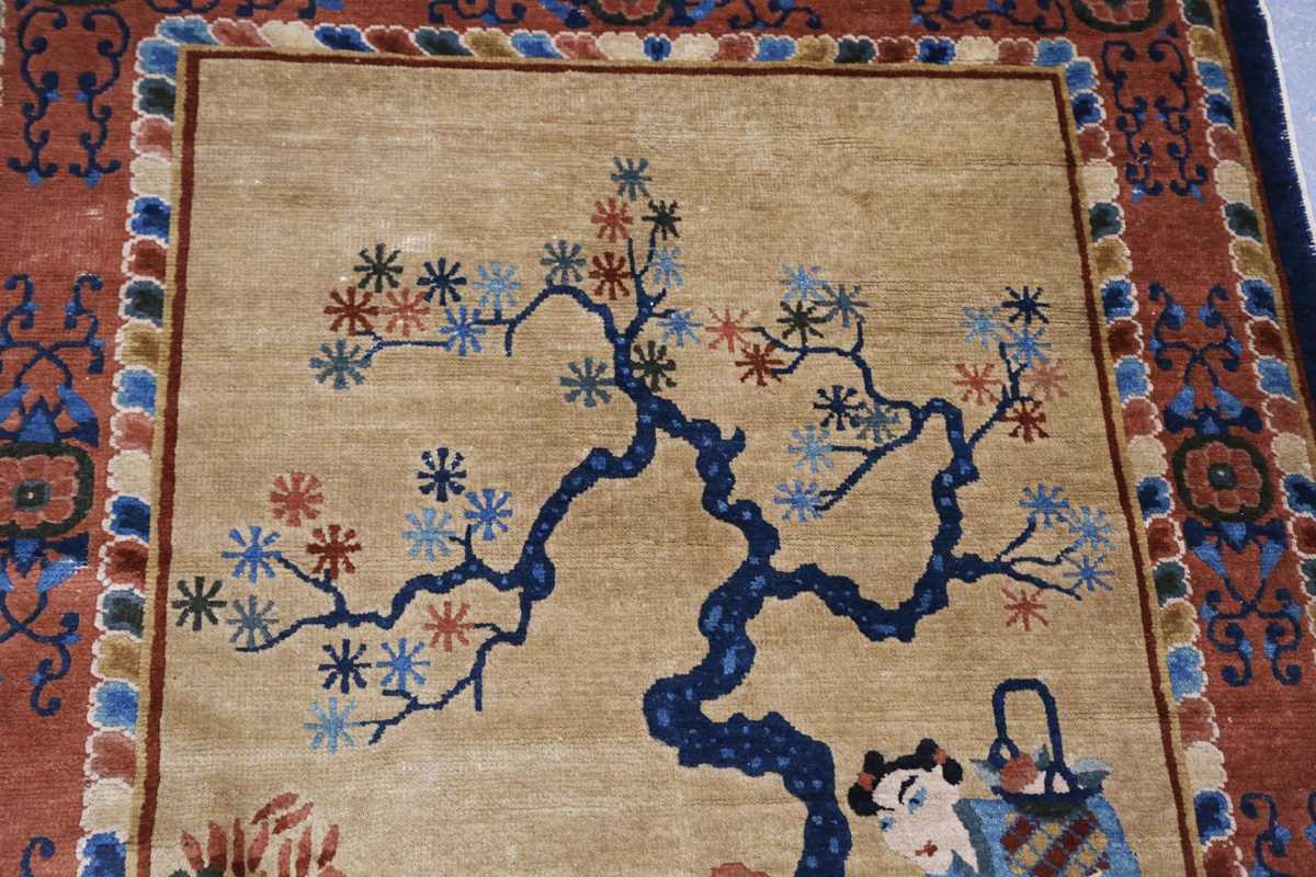 A Chinese rug, early 20th century, the sand-coloured field with standing and seated figures around a - Image 3 of 7