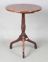 A George III mahogany circular tip-top wine table, raised on tripod legs, height 73cm, diameter