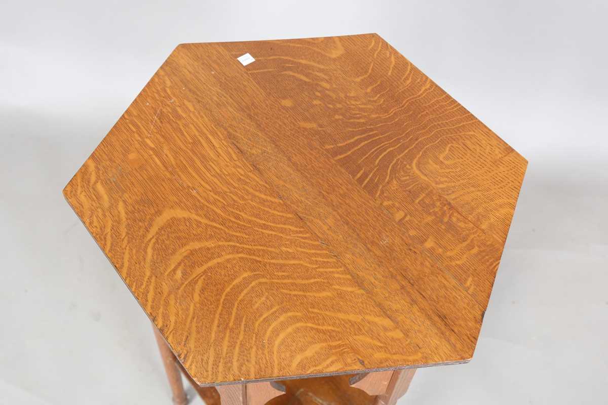 An Edwardian Arts and Crafts oak hexagonal occasional table, possibly by Liberty & Co, the Moorish - Image 2 of 8