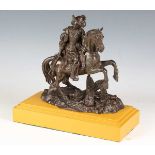 A 19th century French brown patinated bronze equestrian figure of a cavalier on horseback, raised on