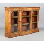 A late Victorian Aesthetic Movement oak breakfront credenza, in the manner of Charles Bevan,