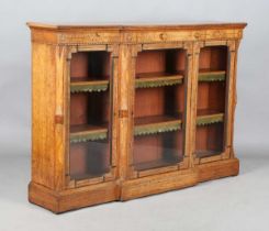 A late Victorian Aesthetic Movement oak breakfront credenza, in the manner of Charles Bevan,