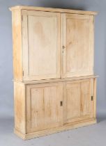 A 19th century pine kitchen cupboard, fitted with four panelled doors, height 213cm, width 171cm,
