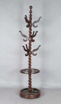 A mid-19th century French walnut hatstand, the barley twist stem issuing nine branches, on a