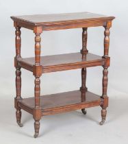 A late Victorian mahogany three-tier whatnot with ring turned legs and castors, height 92cm, width