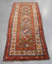 A Kazak runner, Caucasus, early 20th century, the polychrome field with a column of hooked