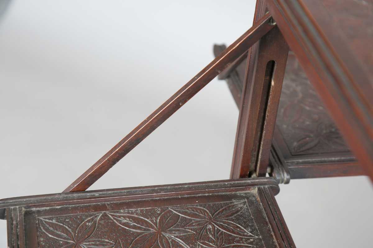 A late Victorian Aesthetic Movement mahogany tea table, fitted with a drop-leaf section to each - Image 6 of 9