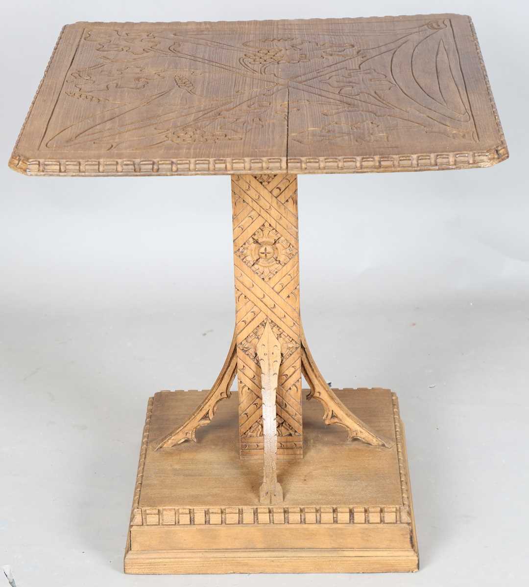 A 20th century Arts and Crafts style carved softwood centre table, the top decorated with wheat - Image 9 of 10