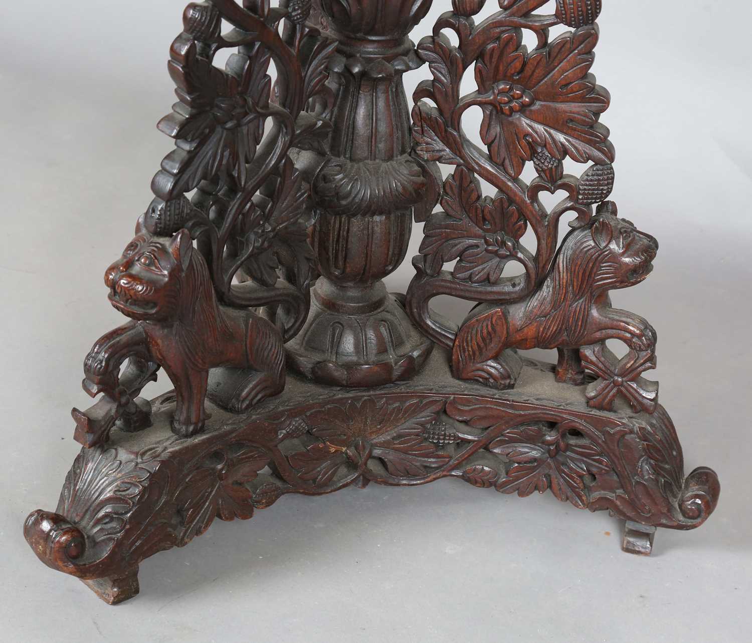 A 19th century Burmese hardwood centre table, the shaped circular top above a tripod support of - Image 8 of 13