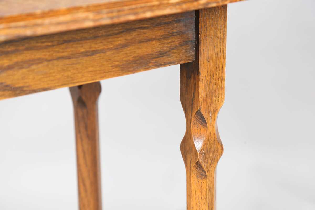 An early 20th century Arts and Crafts style oak canted rectangular occasional table, raised on - Image 3 of 6