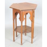 An Edwardian Arts and Crafts oak hexagonal occasional table, possibly by Liberty & Co, the Moorish