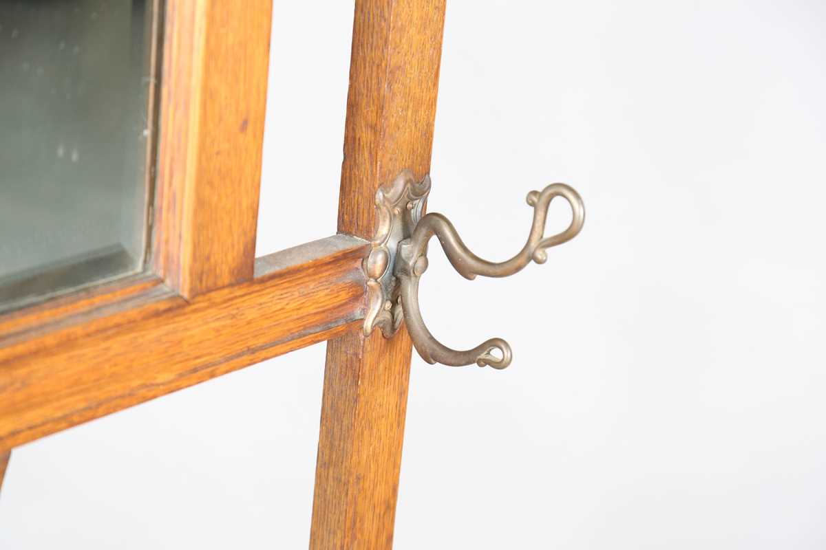 An Edwardian Arts and Crafts oak hallstand, the pediment pierced with stylized tulips, height - Image 6 of 15