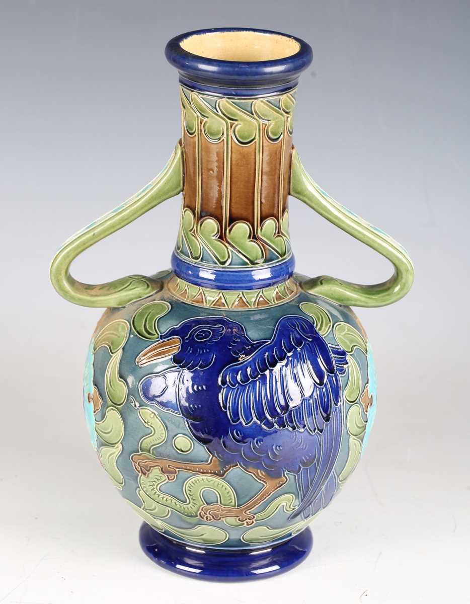 A Burmantofts Faience pottery twin-handled vase, circa 1900, the bulbous body decorated with