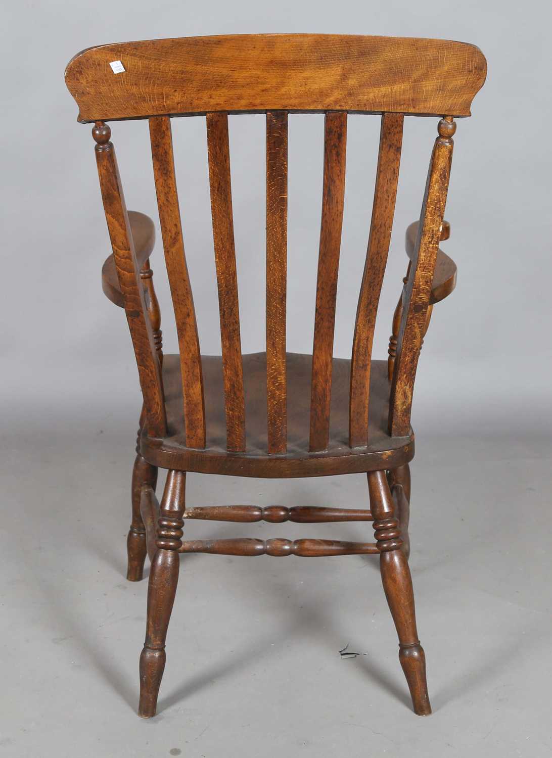 A late Victorian ash and elm comb back Windsor armchair, height 111cm, width 57cm, depth 69cm. - Image 8 of 9