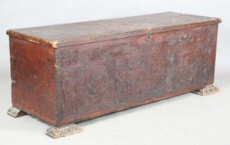 A 19th century Continental fruitwood cassone with overall incised decoration, the interior fitted