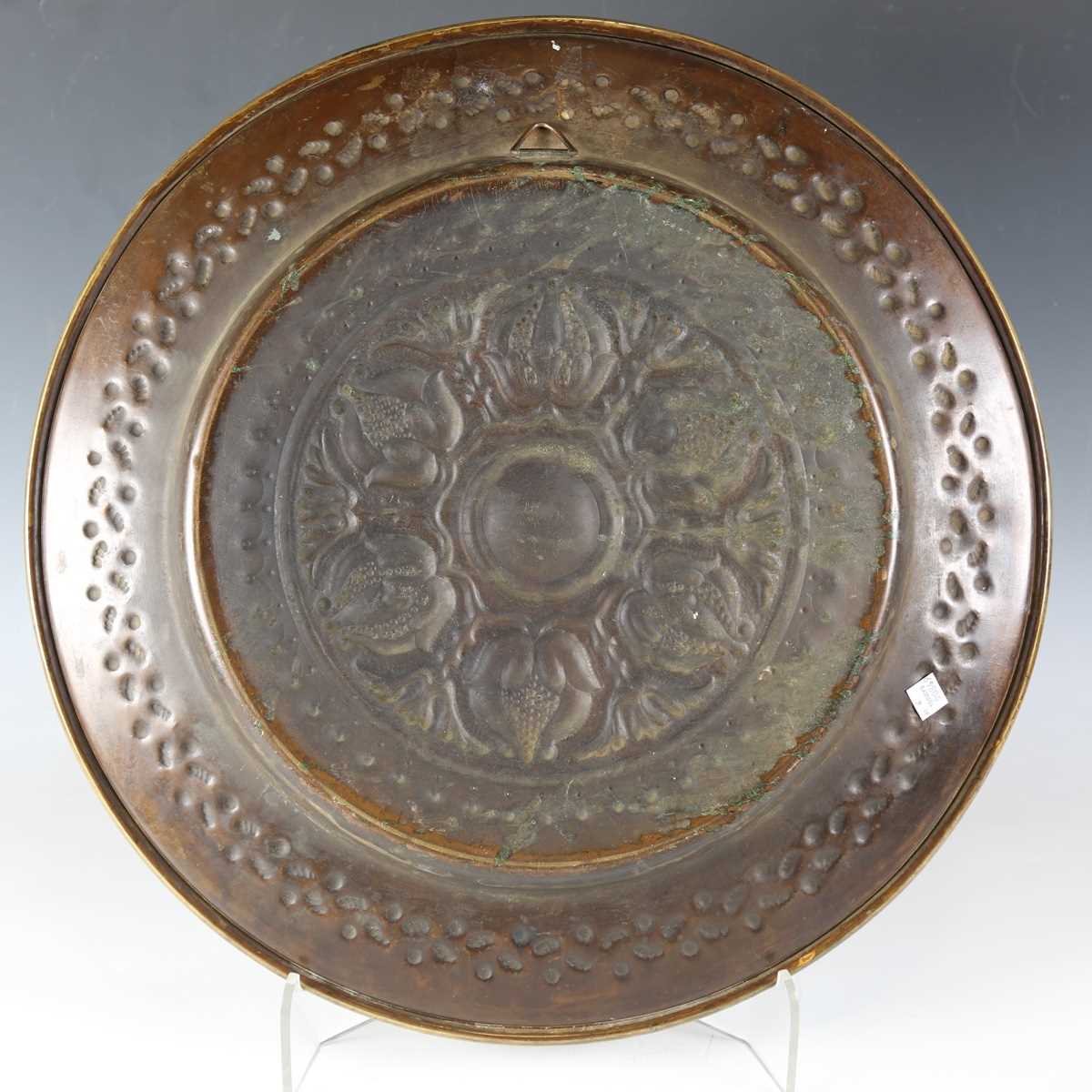 An early 20th century Arts and Crafts brass charger, the centre finely worked with a band of - Image 12 of 17