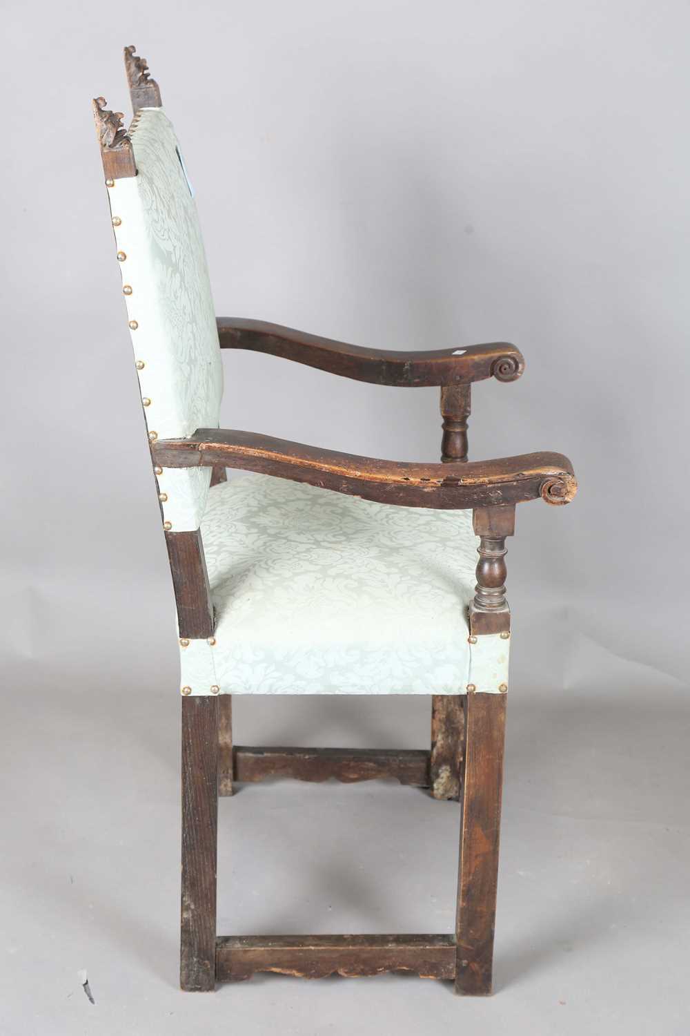 A late 17th century Continental walnut armchair, the finials carved with masks, the two front legs - Image 10 of 15