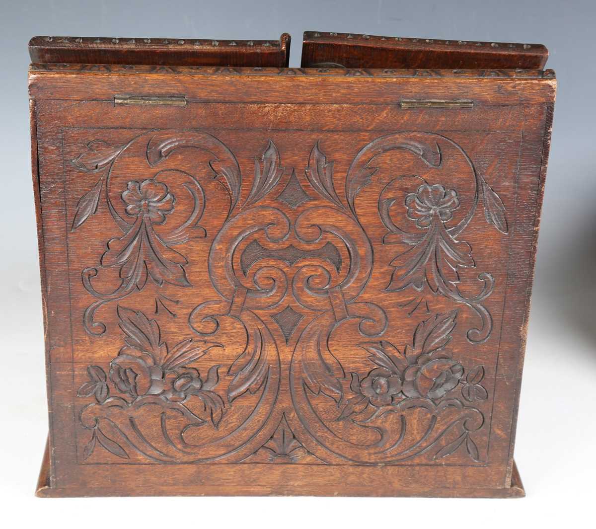 A late Victorian oak slope-front stationery box, carved with leaves and flowers, height 37cm, - Image 9 of 16