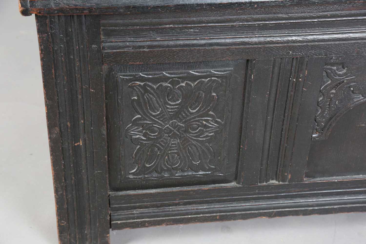 An 18th century panelled oak coffer with a domed lid and carved front, height 61cm, width 125cm, - Image 6 of 12