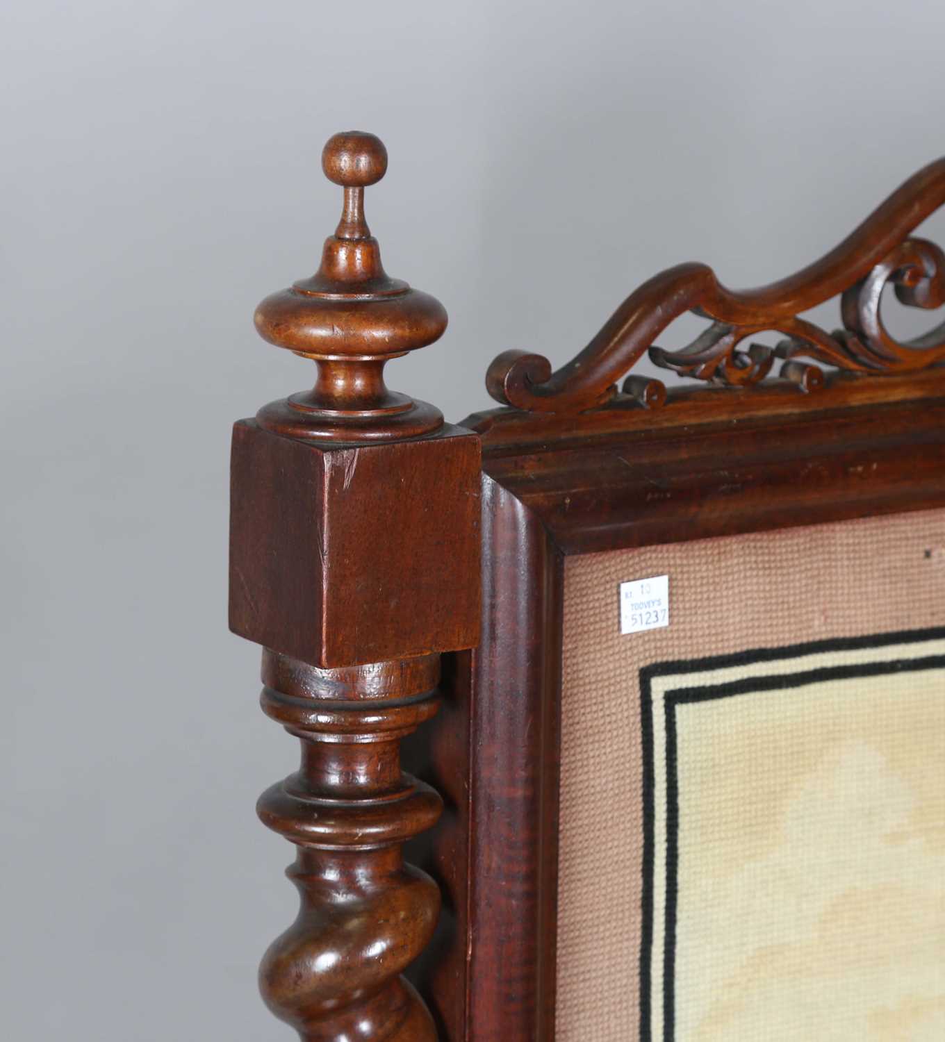 A large mid-Victorian walnut framed firescreen, inset with a woolwork panel and raised on carved - Image 2 of 13