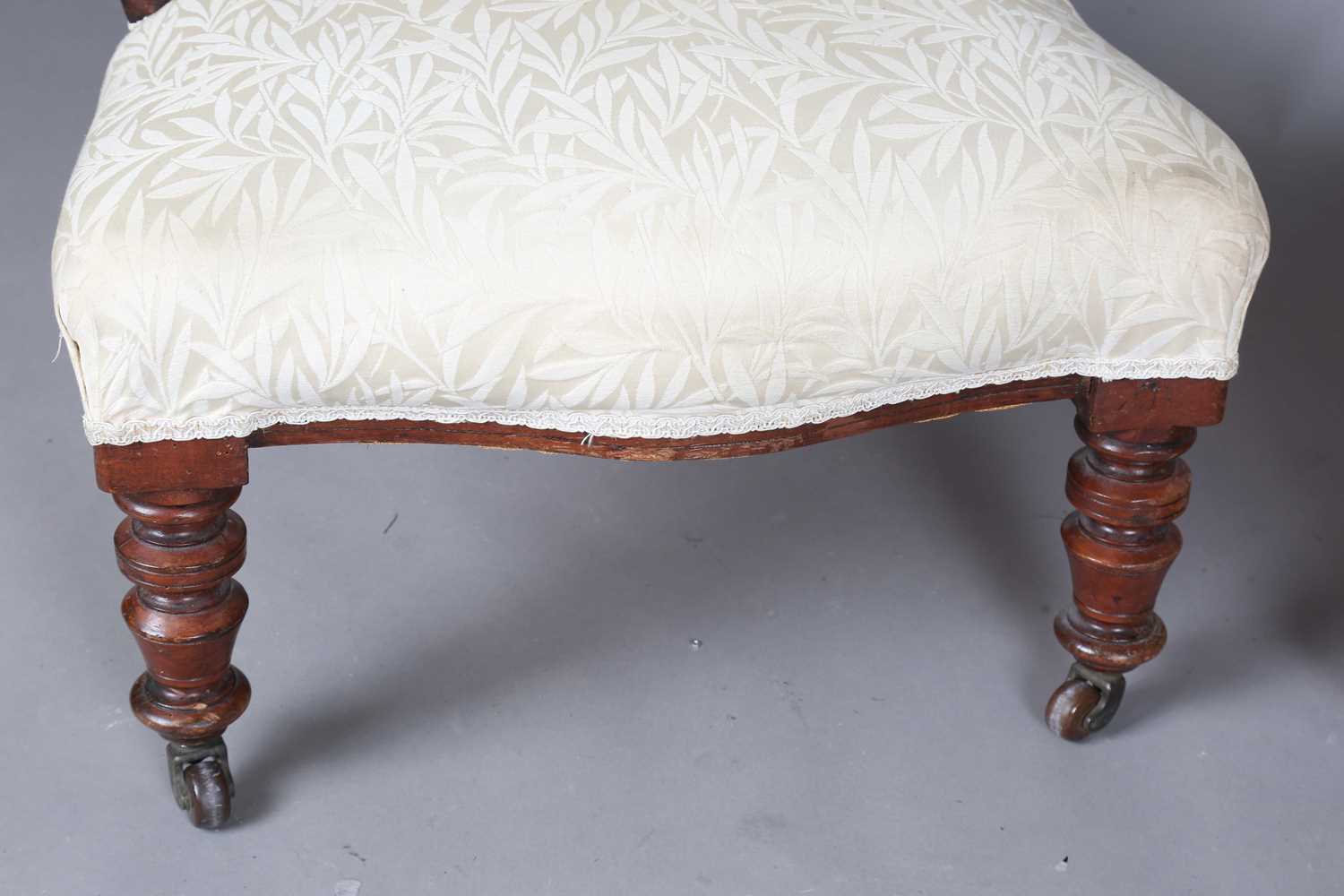 A Victorian walnut showframe balloon back salon chair, upholstered in cream damask, height 86cm, - Image 5 of 14