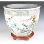 A large Chinese porcelain jardinière stand, painted with birds and flowers, height 44cm, diameter