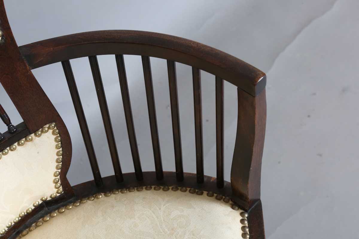 An Edwardian Arts and Crafts style stained walnut showframe armchair, upholstered in cream fabric, - Image 8 of 17