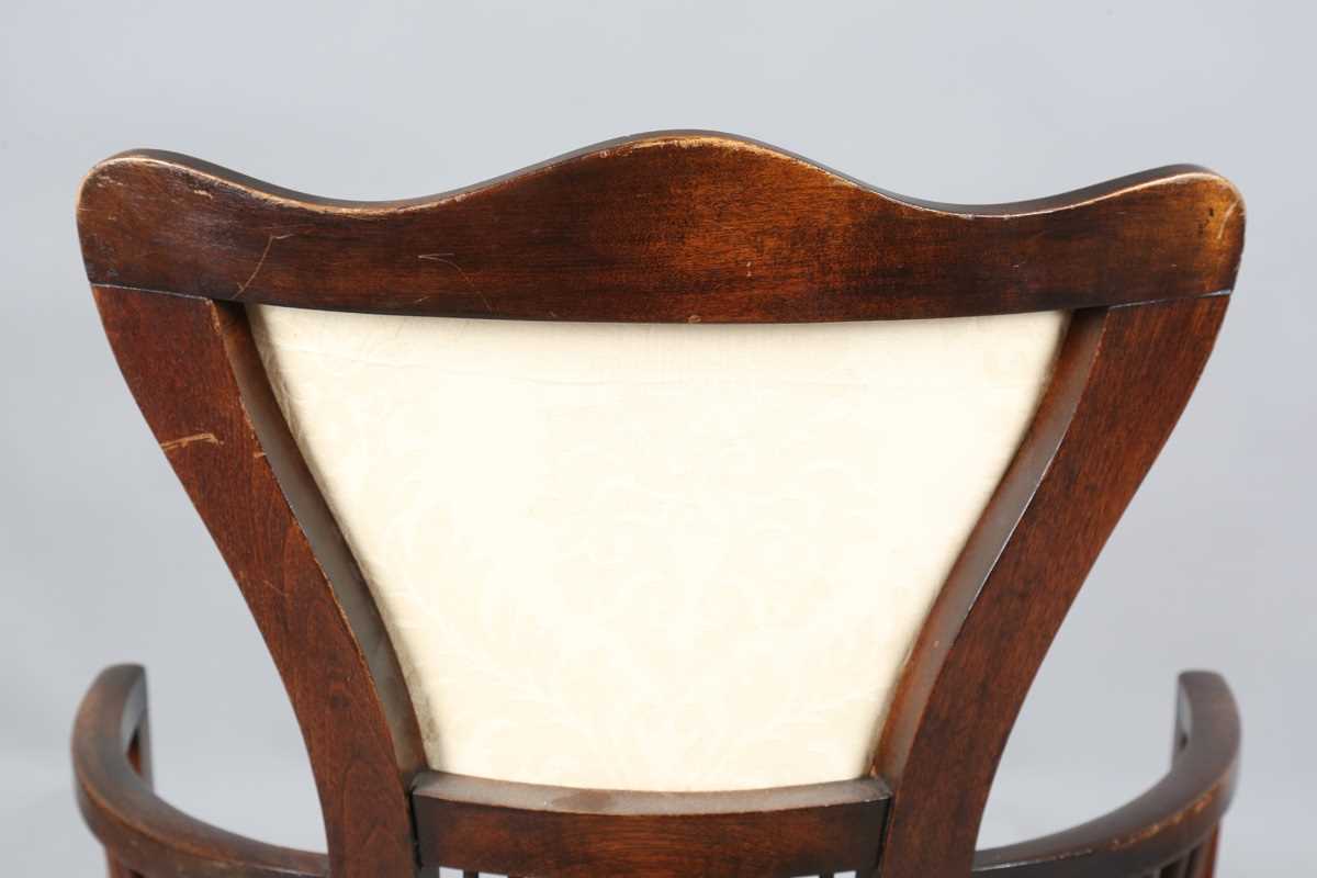 An Edwardian Arts and Crafts style stained walnut showframe armchair, upholstered in cream fabric, - Image 14 of 17
