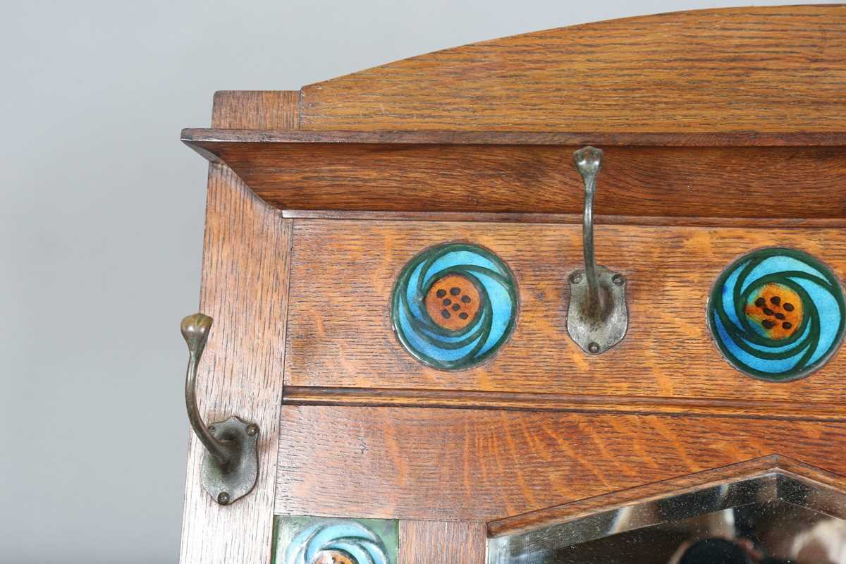 An Edwardian Arts and Crafts Glasgow School oak hallstand, the mirrored back inset with glazed - Image 4 of 13