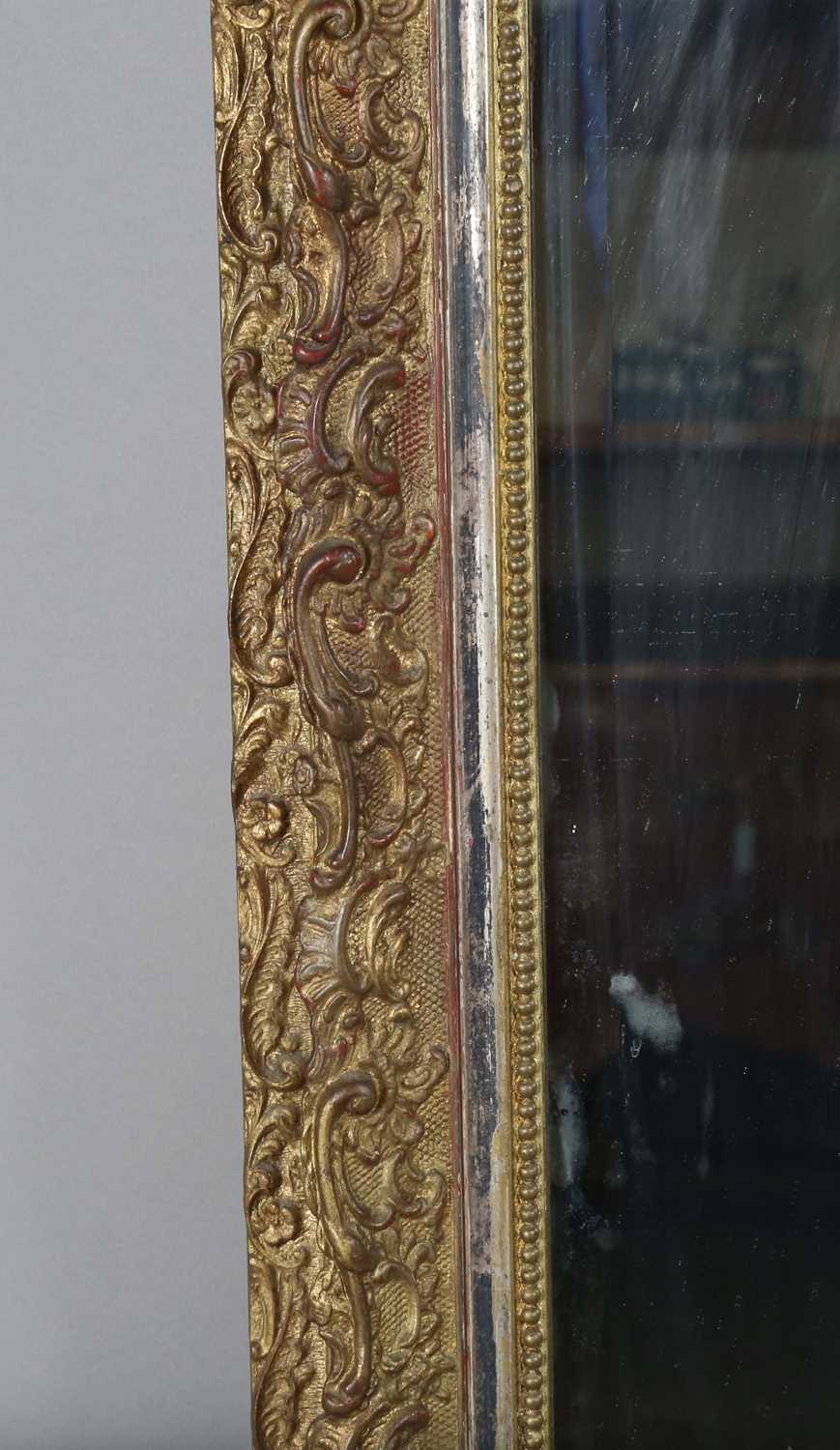 A late 19th century gilt composition arched overmantel mirror with a foliate scroll surmount and - Image 11 of 15
