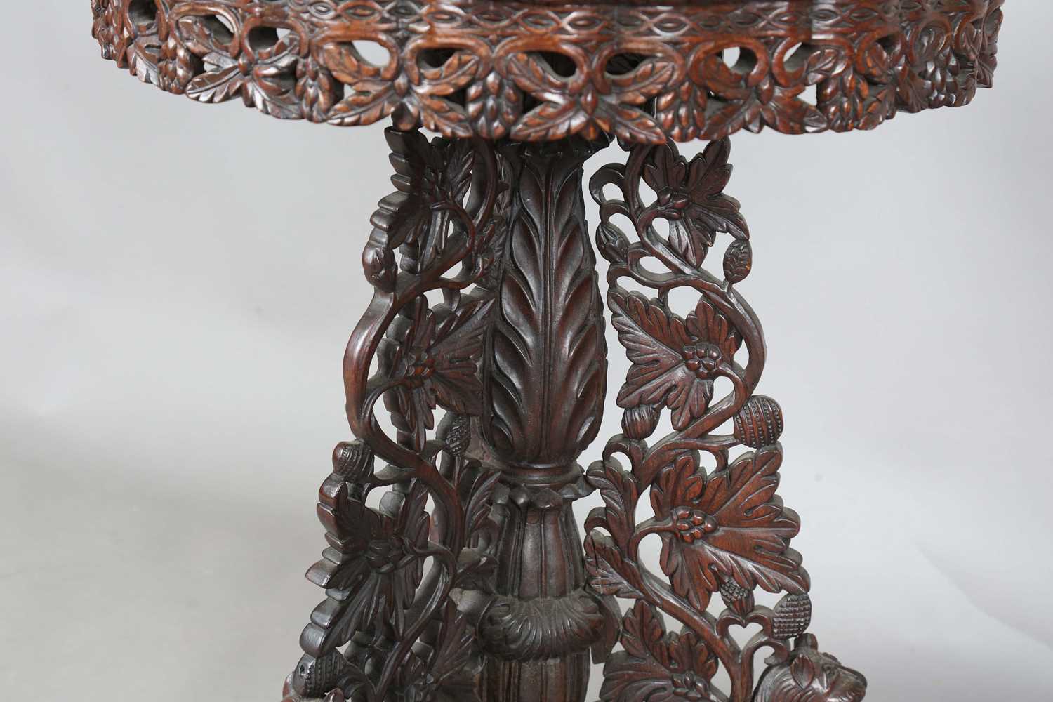 A 19th century Burmese hardwood centre table, the shaped circular top above a tripod support of - Image 7 of 13