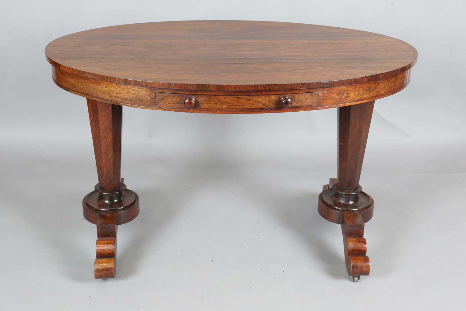 An early Victorian rosewood oval library table, fitted with opposing drawers, on octagonal - Image 10 of 10